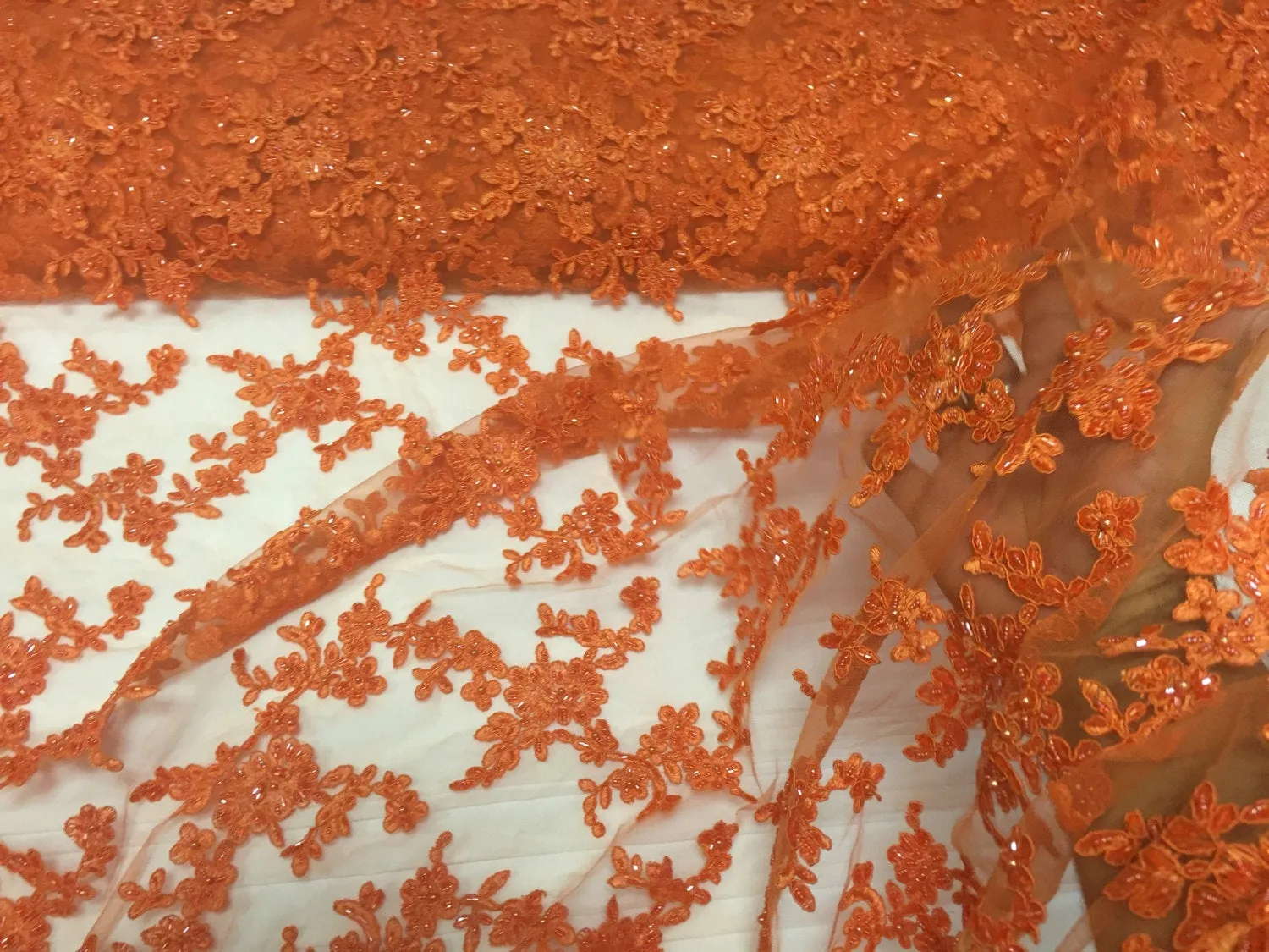 Orange flower tiara design embroider and beaded on a mesh lace-prom-nightgown-decorations-dresses-sold by the yard.